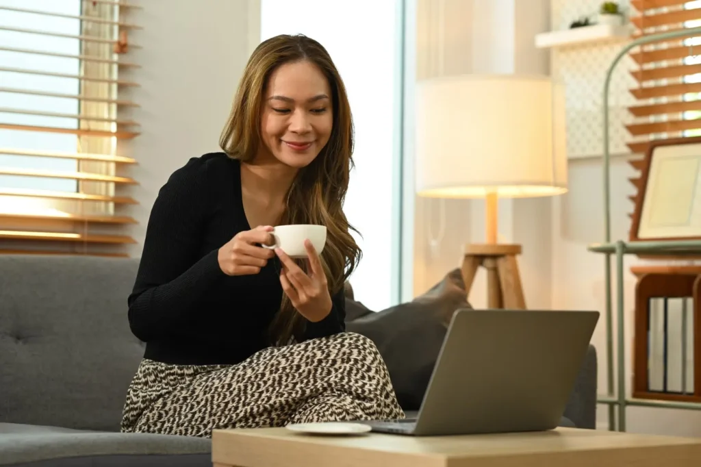 Woman using laptop to make an NDIS referral