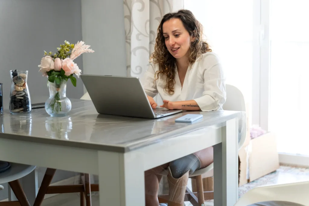 Disabled woman using laptop to contact GUUL